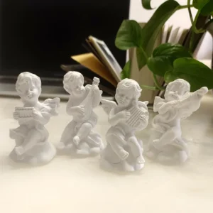 Niedliche Musikengel Statuen